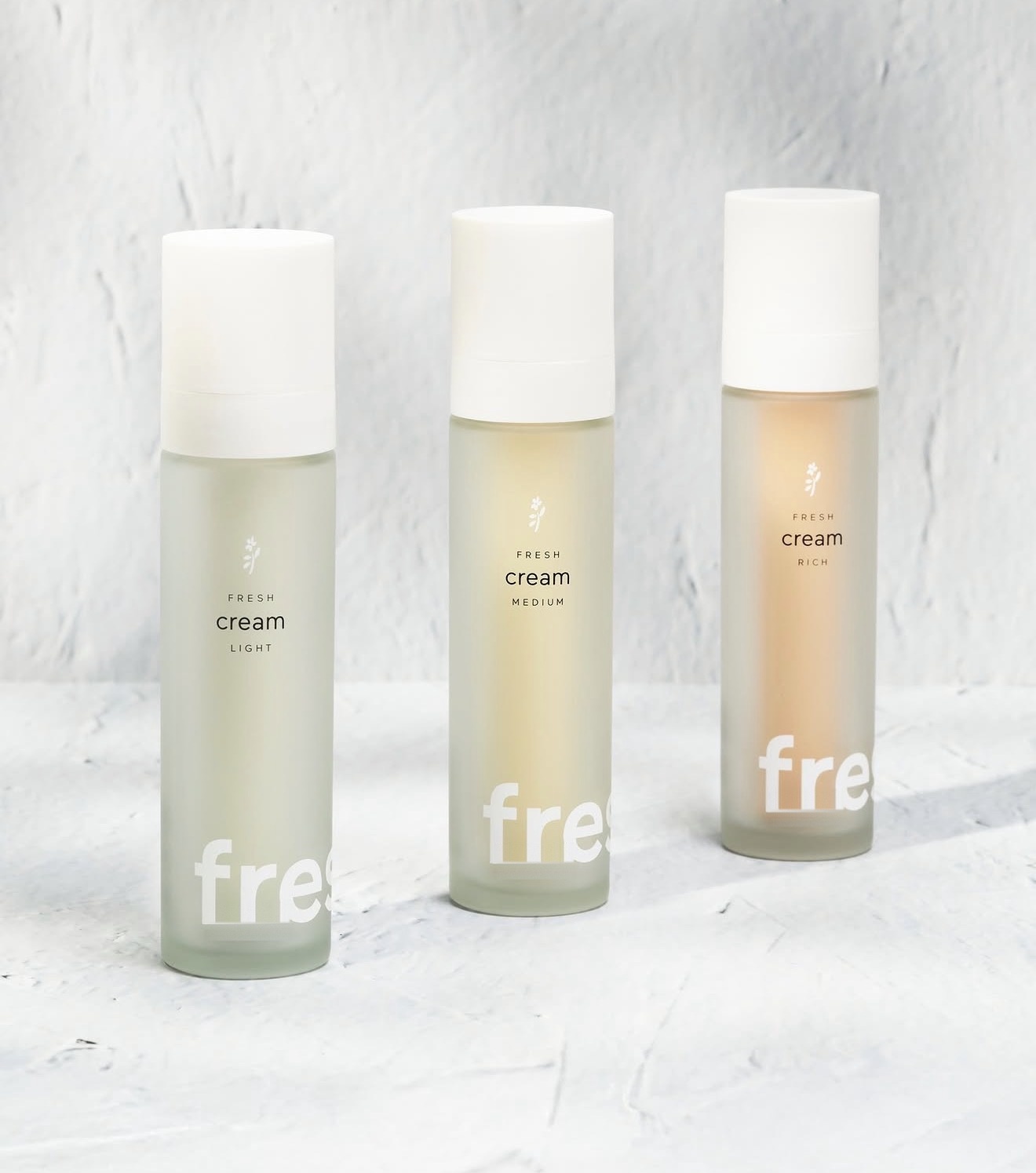 Three fresh cream bottles